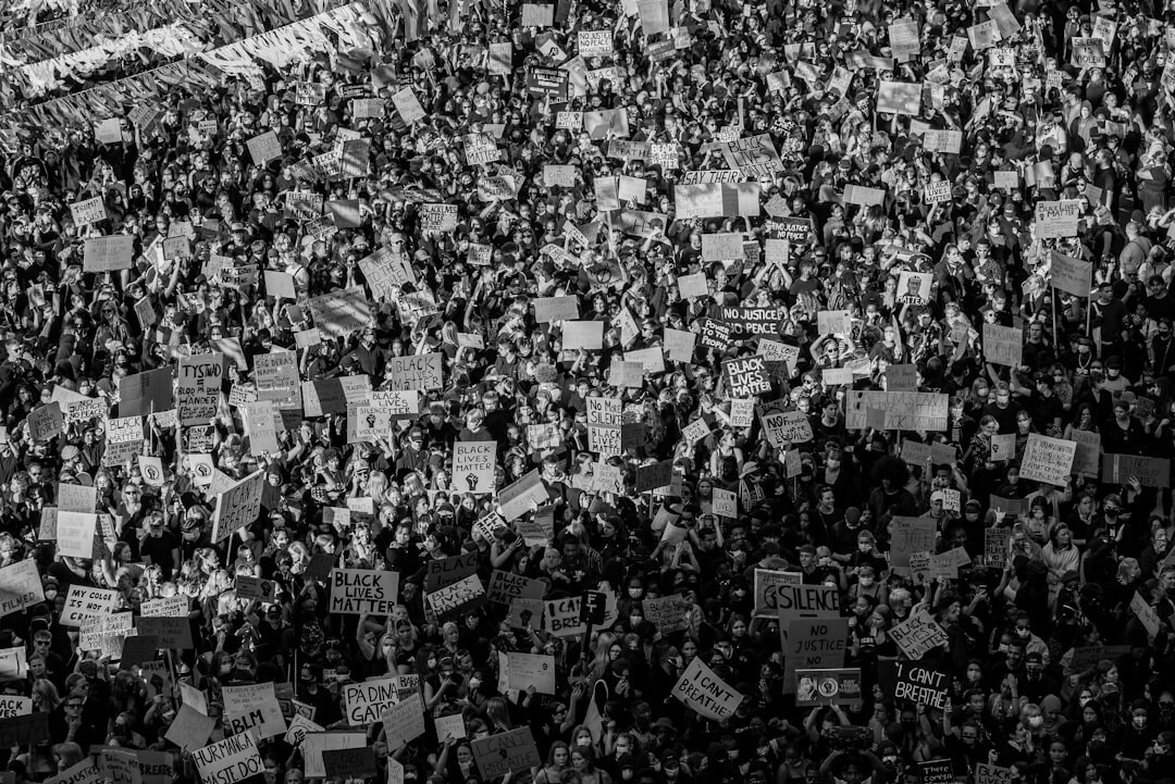 crowd protesting with signs